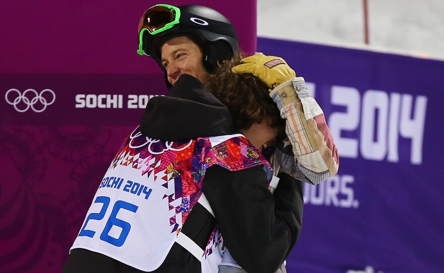 Shaun White, right, congratulates gold medalist Iouri Podladtchikov of Switzerland after the Snowboard Men's Halfpipe Finals of the Sochi 2014 Winter Olympics Tuesday.