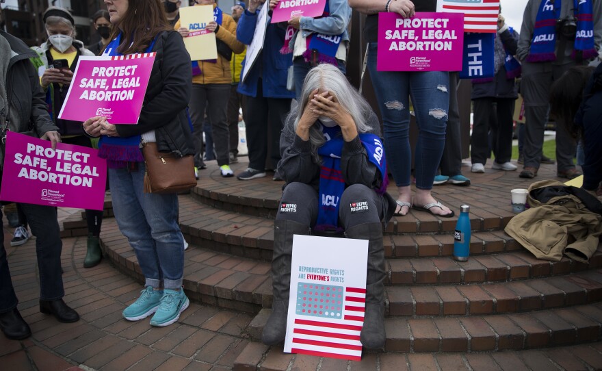 <strong>Seattle</strong>: Jackie Jacobs holds her head in her hands before the start of a pro-choice rally.