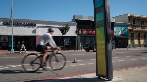 A cyclist rides past a bike counter on 30th Street in North Park, Jan. 30, 2026.