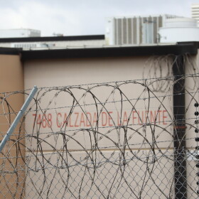 Barbed wire lines the fence of the Otay Mesa Detention Center on Thursday, April 2, 2026.