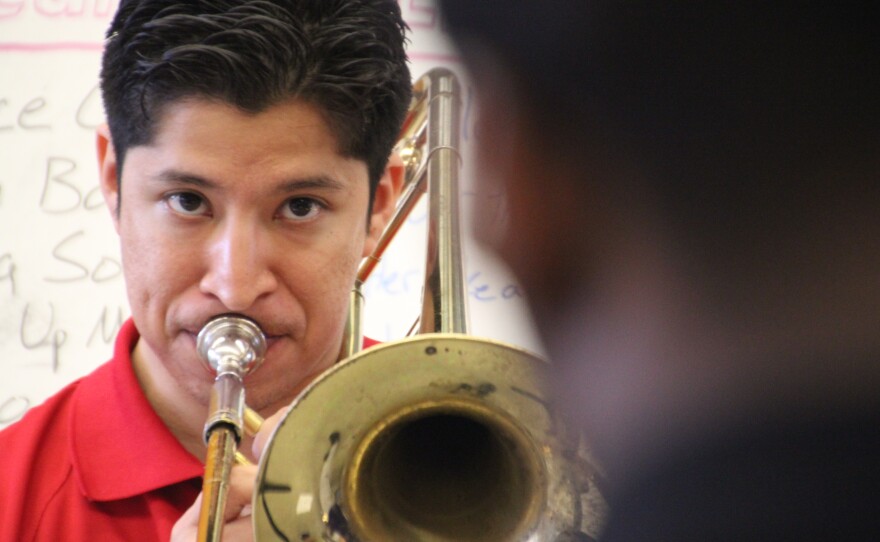 Christopher Herrero, a tuba player at Karr a decade ago, was hired as band director four years ago.