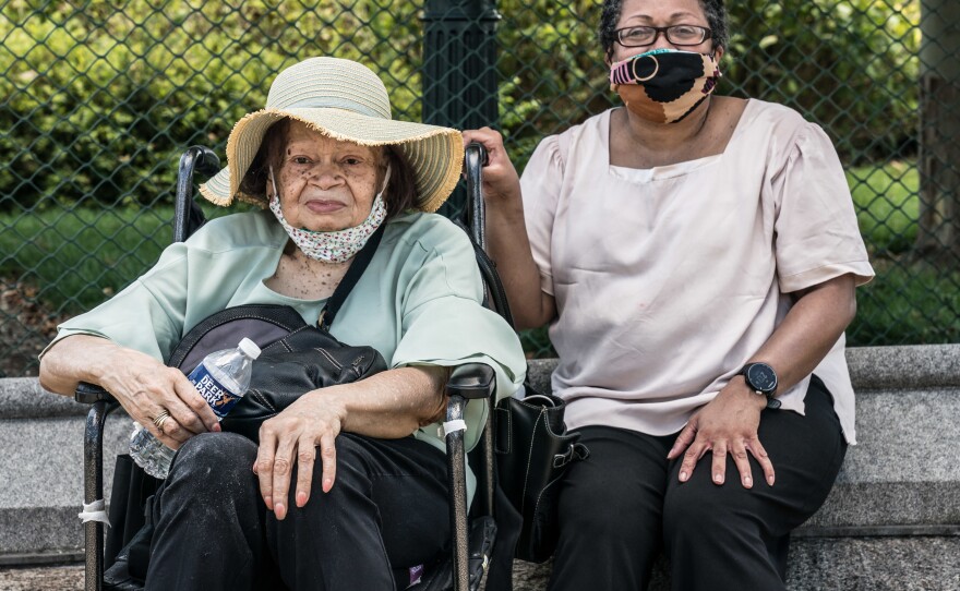 Mae Eversley, 92, from New York City, right, sits with her daughter Melanie Eversley, 58, also from New York City.