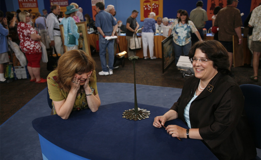 Kerry Shrives (right) appraises a Tiffany Studios candlestick, ca. 1905, in Palm Springs, Calif. 