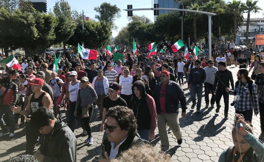 A few hundred people gathered in Tijuana's high-end Rio area on Sunday to protest against groups migrating from Central American countries.