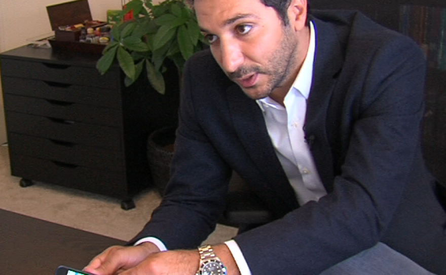 Daniel Yazbeck connects his iPhone to a prototype MyDx cannabis sensor. May 8, 2014. 