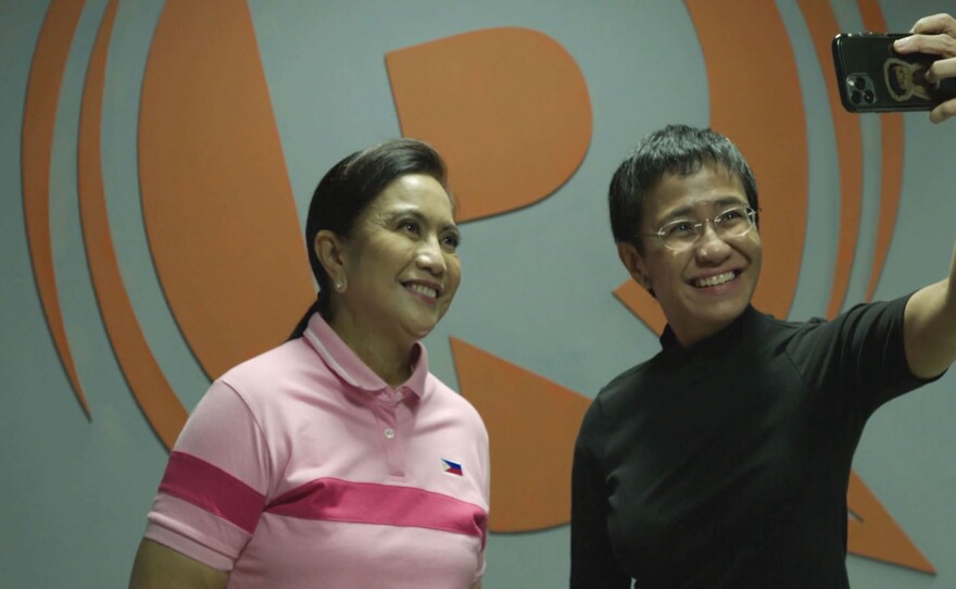 Leni Robredo (left) and Maria Ressa (right) selfie in front of Rappler.
