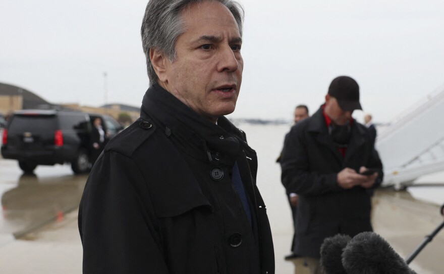 U.S. Secretary of State Antony Blinken speaks to members of the media, before departing for Brussels from Joint Base Andrews, in Maryland, on Tuesday.