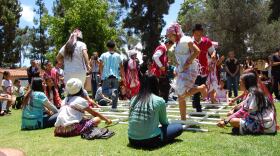 Karen youth perform a traditional bamboo dance during the World Refugee Day festivities at Balboa Park on June 21, 2014.