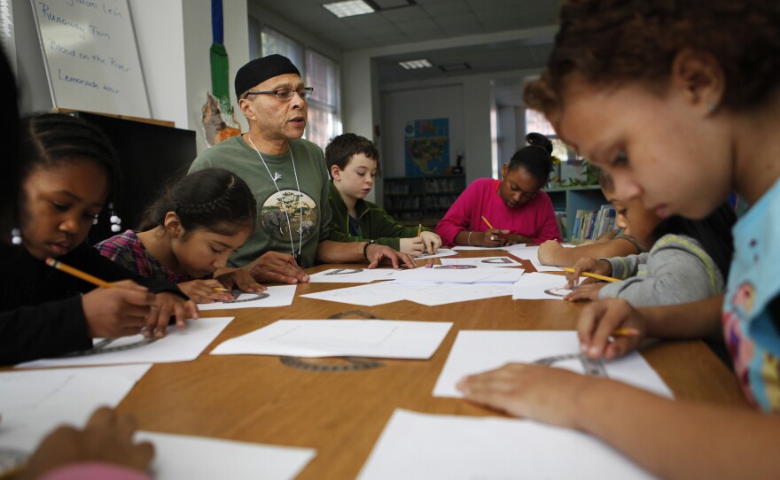 Lower elementary teacher John Cearnal leads a math lesson with first-, second- and third-graders.