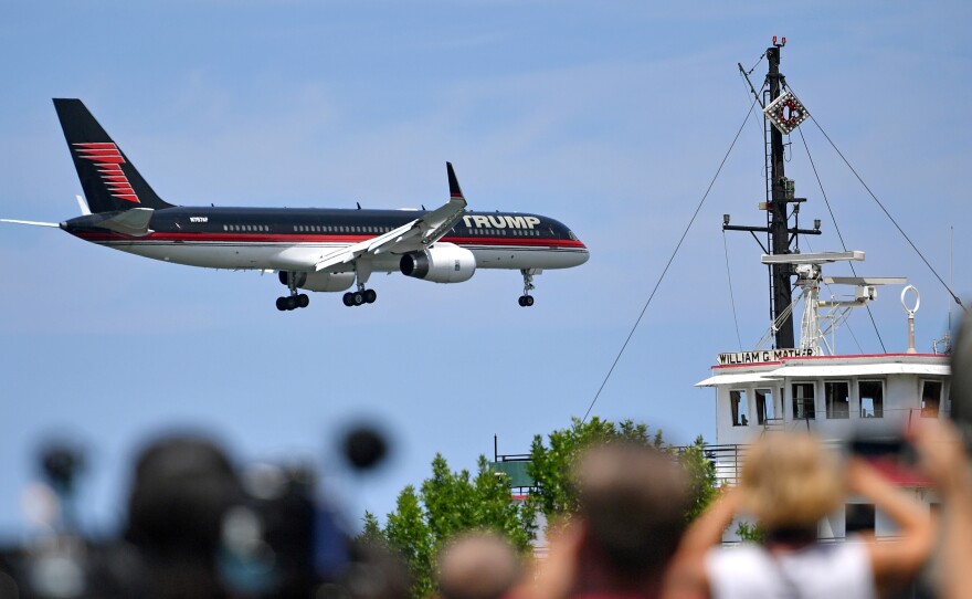 Donald Trump's plane arrives at a welcome event with Gov. Mike Pence at the Great Lakes Science Centre on Wednesday in Cleveland.
