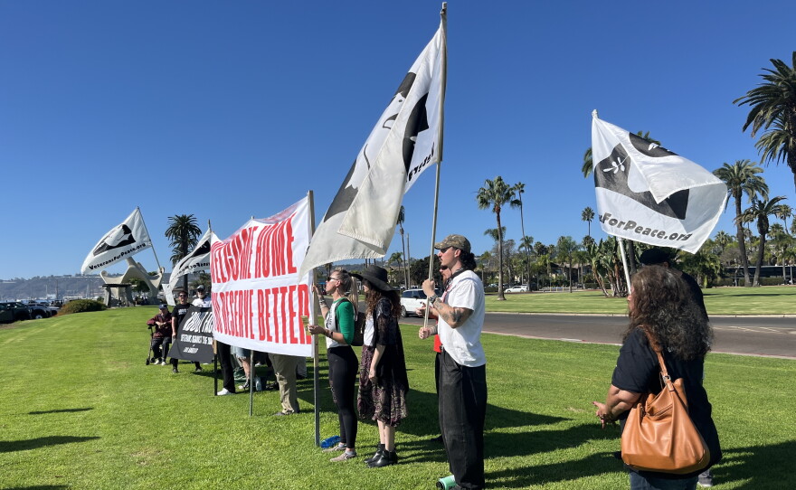 Protestors gather at Shelter Island ahead of USS Lincoln arrival, Oct. 8, 2026.