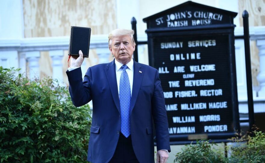 Then-President Donald Trump holds up a Bible in front of St. John's Church after walking across Lafayette Park from the White House on June 1, 2020.