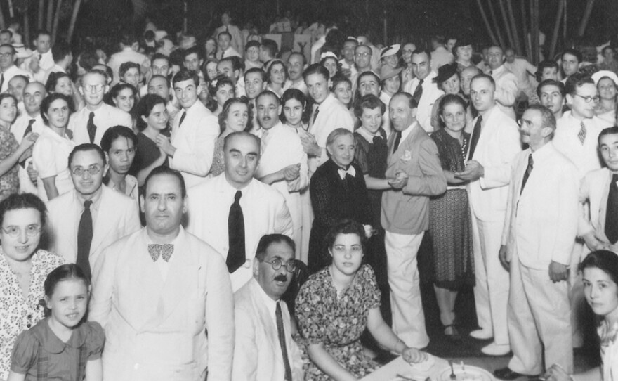 Refugees attend dinner at the Frieders' home on April 30, 1940.