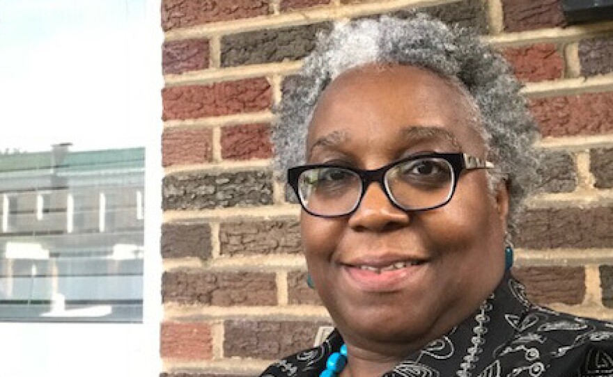 Wanda Onafuwa says a house next door to her in Baltimore fell into disrepair after Bank of America foreclosed on the property.