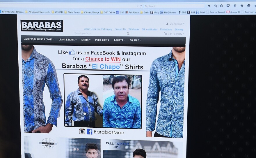 A woman looks at the home page of the clothing house Barabas on Tuesday. At the time, the site featured two photos of Mexican drug kingpin Joaquin "El Chapo" Guzmán. Today the site shows a different ad — one that, again, stars El Chapo.