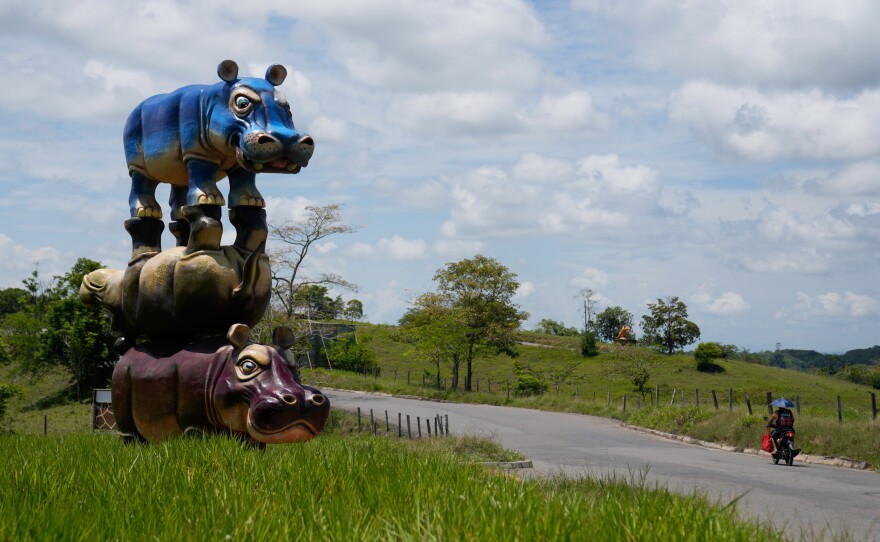 A stack of three hippo statues stands at Hacienda Nápoles Park, once the private estate of drug kingpin Pablo Escobar, in Puerto Triunfo, Colombia.