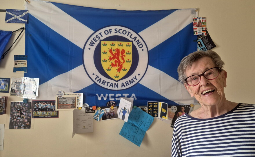 Moira Brown, 93, at her home in Glasgow, where the walls are plastered with Scotland soccer memorabilia.