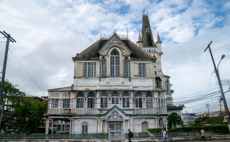 Georgetown's aging city hall was recently scheduled for renovation. The capital city sits on the coast, protected by the seawall.
