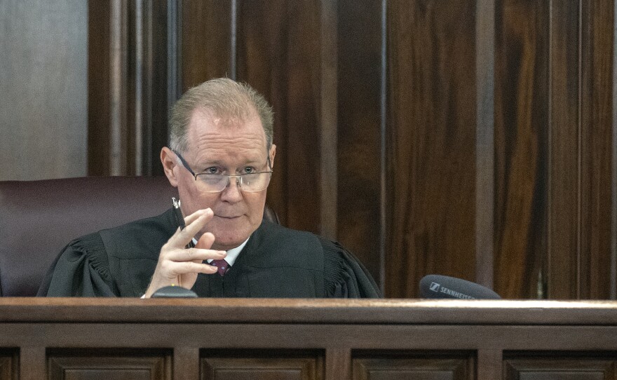 Superior Court Judge Timothy Walmsley responds to arguments during a motion hearing in the trial of Greg McMichael and his son, Travis McMichael, and a neighbor, William "Roddie" Bryan in the Glynn County Courthouse on Thursday.
