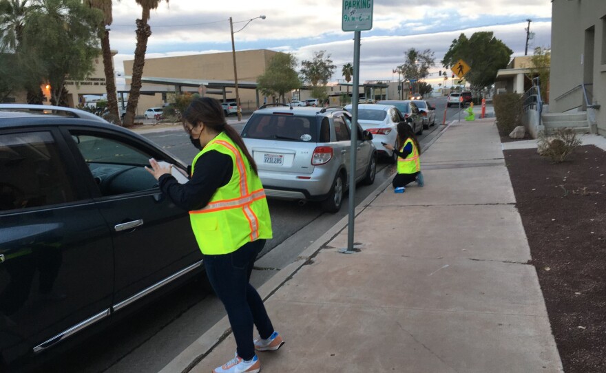 Vehicles line up outside Imperial County's administrative offices on Jan. 23, 2021, for a COVID-19 vaccine clinic. The county administered 281 doses to in-home support service providers.