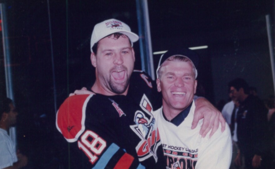 Martin St. Amour (left) celebrates with Ernie Hahn (right) after winning the Taylor Cup in 1998.