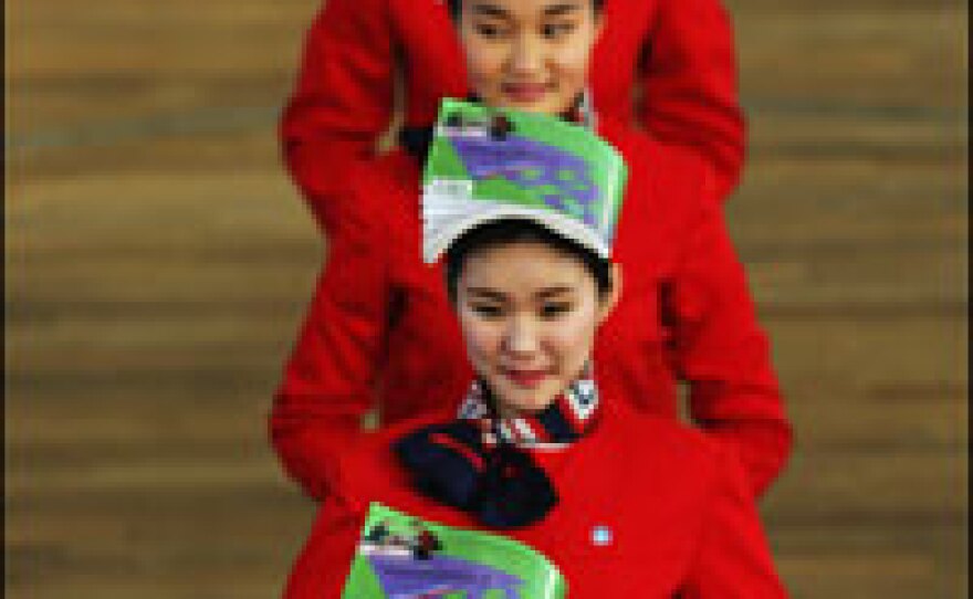 Students attend an etiquette class at Changping Vocational School in Beijing in January. Those selected will become hostesses for medal ceremonies during the Olympics — an event China sees as an opportunity to wow the world.