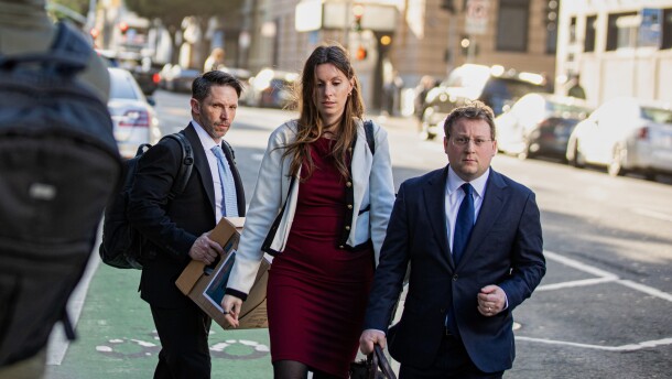 Members of Elon Musk's legal team, including attorney Michael Lifrak (left), exit the Phillip Burton Federal Building in San Francisco on March 4.