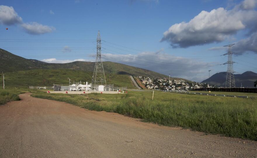 Sempra natural gas pipeline crossing at the border near Otay Mesa, California. Homes in the background are in Mexico. March 23, 2017.