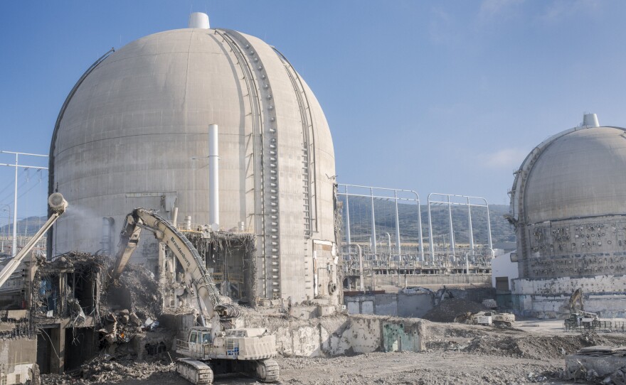 Demolition crews are working to clear the auxiliary building outside the iconic domes at San Onofre Nuclear Generating Station, Dec. 16, 2025.