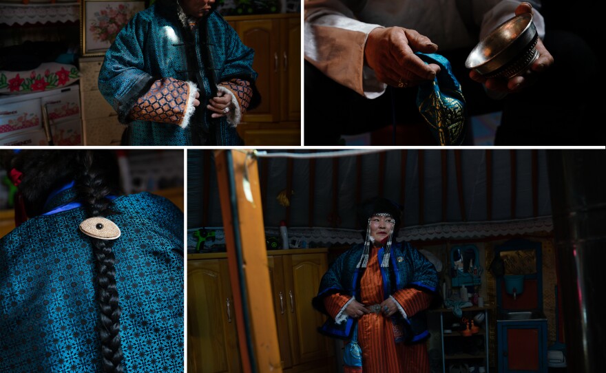 Gobi herders Enkhbaatar Dashnyam (left), 59, and Dulamsuren Yunden, 47, dress for the festival's Beautiful Couple Contest. The pair don turquoise jackets, orange deels — traditional Mongolian overcoats — and utensils and decorations passed down through the generations, including a silver bowl for drinking milk tea, and jewelry.