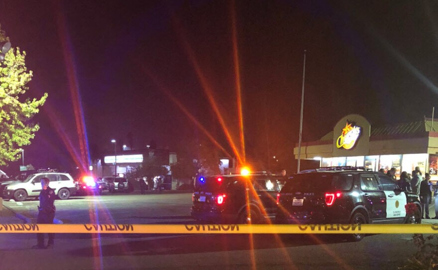 San Diego police officers at the scene of a fatal shooting at a Church's Chicken in Otay Mesa, Nov. 6, 2019.