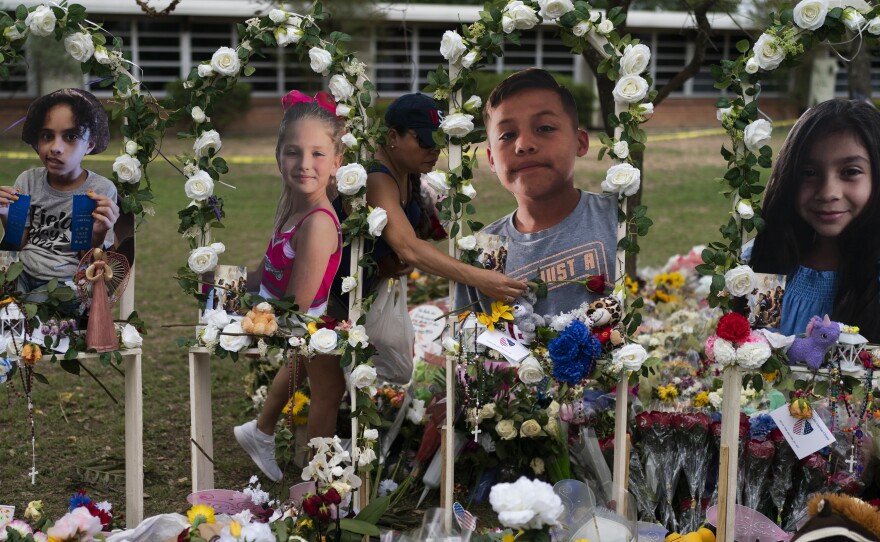 A memorial at Robb Elementary School in Uvalde, Texas on Monday. Photographs of the victims, from left, show Layla Salazar, Makenna Lee Elrod, Jayce Carmelo Luevanos and Nevaeh Alyssa Bravo.