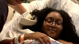 In this undated photo, Chinasa Campoverde holds her son Isaiah James who died after birth, while her husband James Campoverde looks on. 