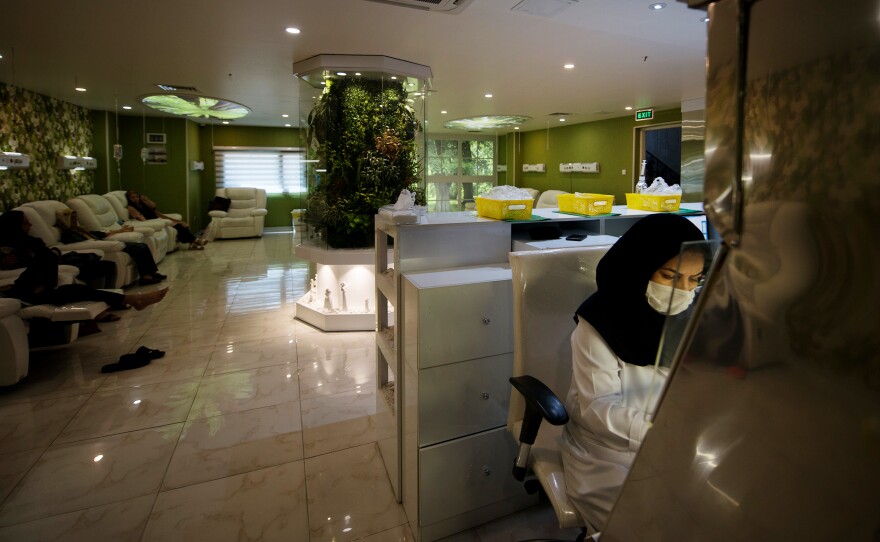 Cancer patients receive chemotherapy treatment at Roshana Cancer Center, a private clinic in western Tehran.