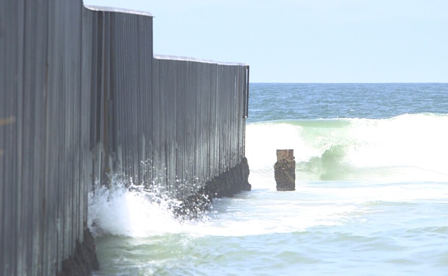 The U.S.-Mexico border fence extends into the Pacific Ocean at Imperial Beach, July 13, 2017. 