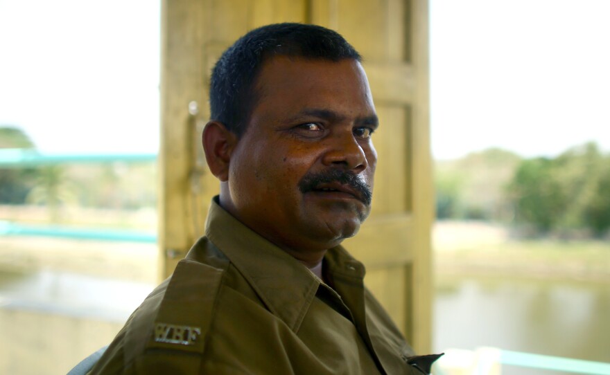 Debnath Mondal was attacked by a tiger in 2010. "I saw the tiger coming in. Everyone shouted, 'Tiger!' But before I could do anything, it pounced on me. It landed on my thighs and chest and bit my face and head," he says. Though seriously injured, he continues to work as a guard in the national park in the Sundarbans.