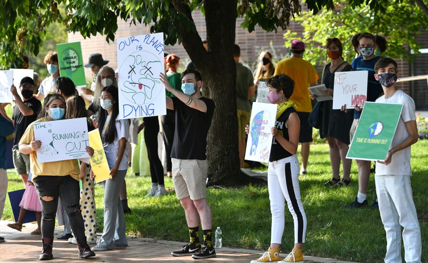 Young activists rallied in front of the Lawrence, Kansas, City Hall to urge city leaders to follow through on sustainability commitments.