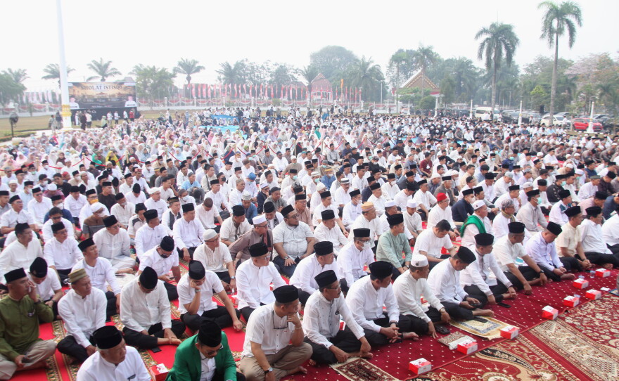 Indonesian Muslims attend a prayer requesting for rain following wildfires that burn through peatlands in several regions in Sumatra and Kalimantan Island, in Palembang, South Sumatra, Indonesia, Tuesday, Aug. 25, 2026.