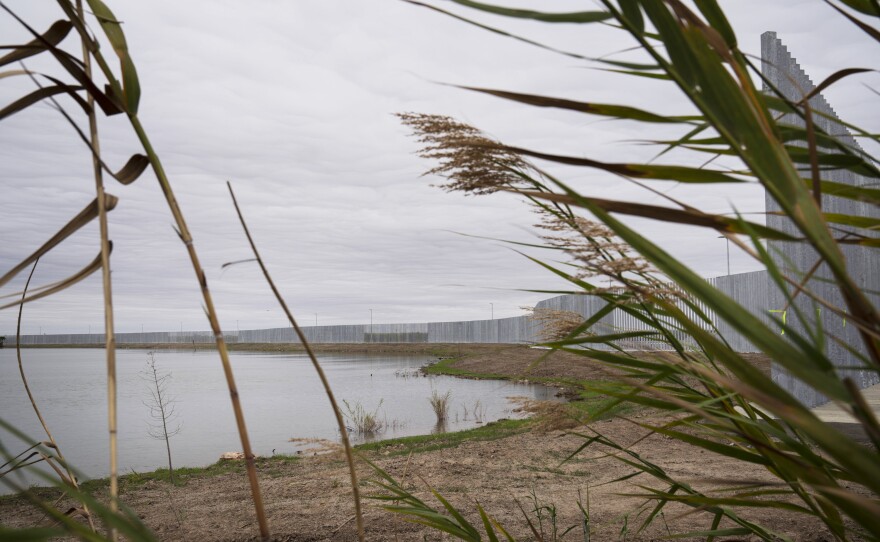 The privately funded border wall built on private land can be seen from Cavazos' property in front of the Rio Grande.