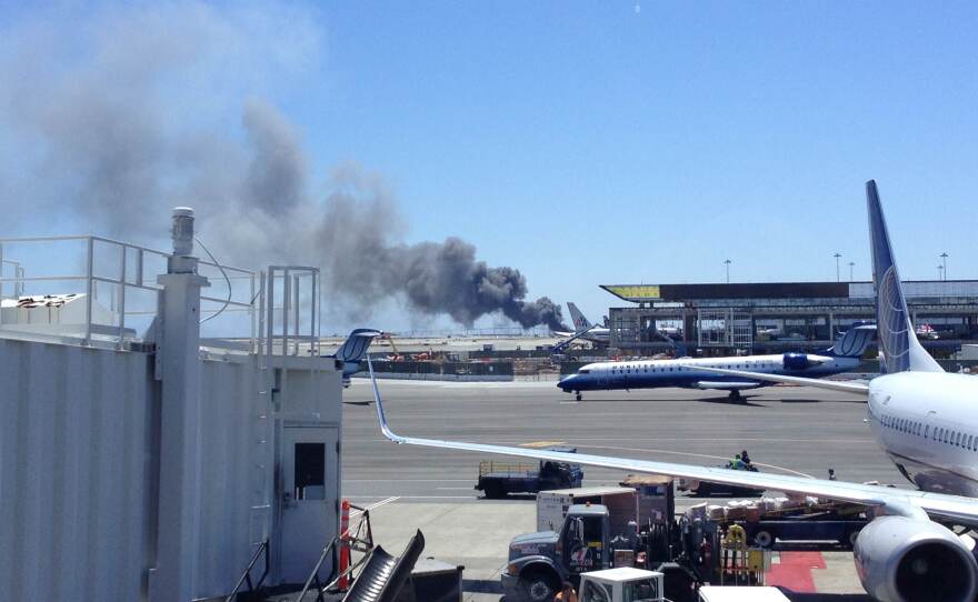 A photo of the aircraft provided by Zach Custer. One witness inside the terminal said travelers couldn't hear the crash, but as soon as they saw the plane "there was just a lot of uncertainty and commotion."