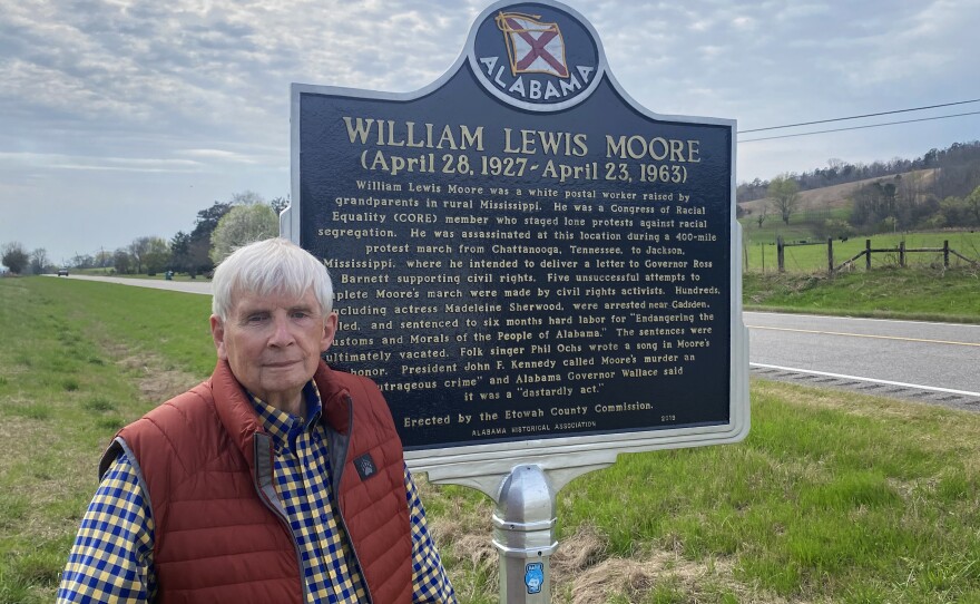 Jerry Smith stands by a historical marker that describes how civil rights activist William Lewis Moore died in 1963.