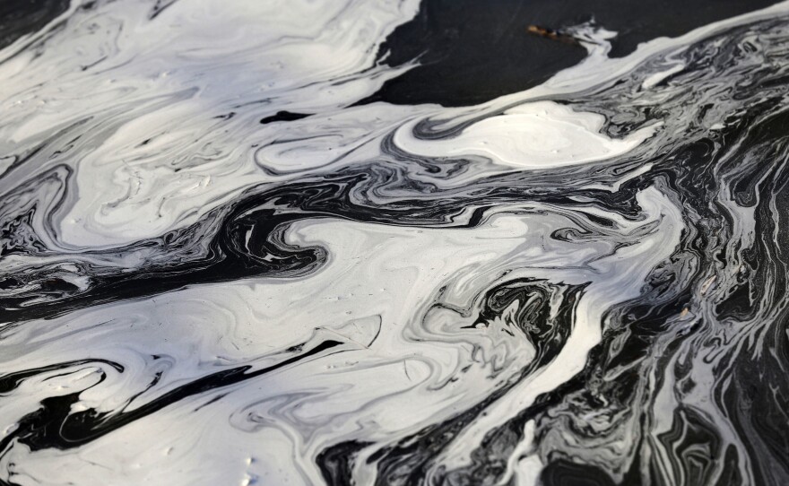 Coal ash swirls on the surface of the Dan River on Feb. 5, 2014 after <a href="https://www.epa.gov/enforcement/case-summary-duke-energy-agrees-3-million-cleanup-coal-ash-release-dan-river">tens of thousands of tons</a> of coal ash spilled from a Duke Energy power plant into the Dan River at Eden, North Carolina, causing damage for 70 miles downstream.