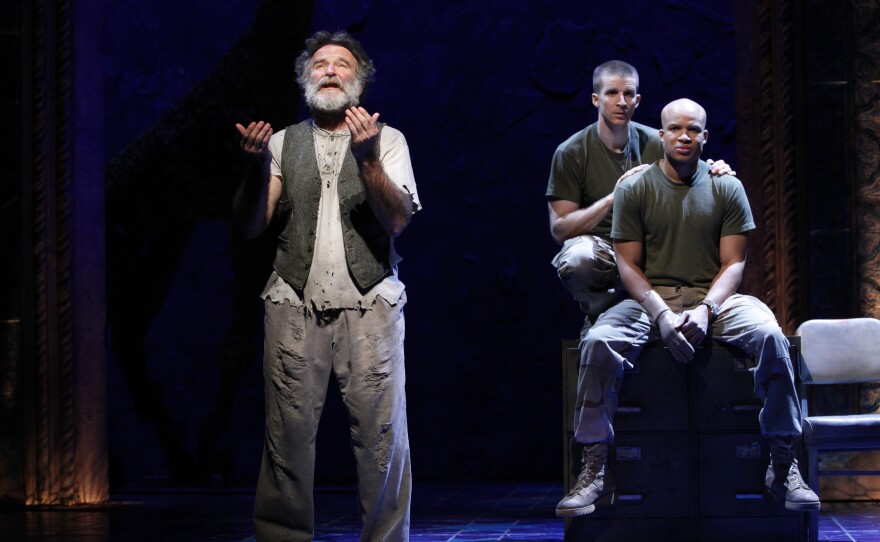 Williams (left), Brad Fleischer and Glenn Davis perform in Rajiv Joseph's Bengal Tiger at the Baghdad Zoo in 2011. Director Moises Kaufman said the play is "part ghost story, part war play, part satire, part theater of the absurd."