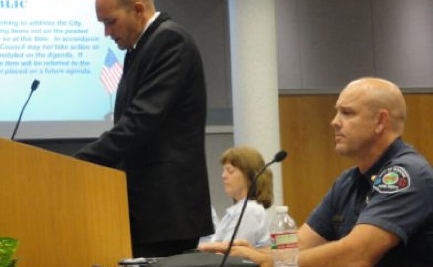 SFFA President Harley Wallace speaks to council members in July about the association's vote of no confidence in Fire Chief Bob Leigh as he sits feet away.