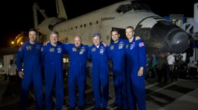 In this handout provided by National Aeronautics and Space Administration (NASA), The STS-134 astronauts from left, European Space Agency's Roberto Vittori, Gregory H. Johnson, pilot; Mark Kelly, commander; Michael Fincke, Greg Chamitoff, and Andrew Feustel, all mission specialists, pose for a group photograph shortly after landing onboard the space shuttle Endeavour at the Shuttle Landing Facility (SLF) at Kennedy Space Center, on June 01, 2011, in Cape Canaveral, Florida.  