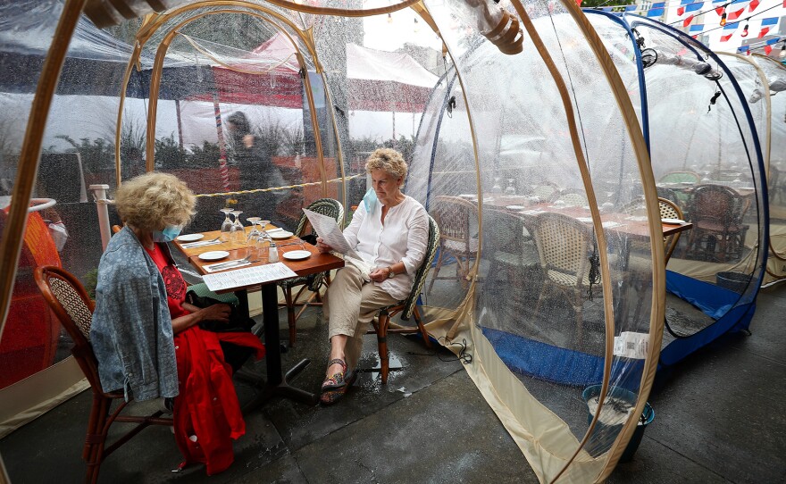 The latest pandemic dining twist: the outdoor bubble, seen here at a New York City restaurant. Sure, it's a way to stay warm as winter looms ... but does it reduce your risk of getting infected by COVID-19?