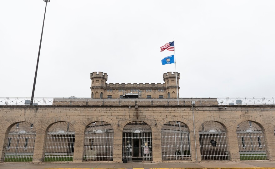 Limestone brick archways mark Waupun Correctional Institution's main entrance. Many rural, predominantly white prison towns see their population numbers boosted by prison populations disproportionately made up of black and Latinx people.