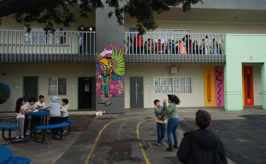 Students play and talk during recess at Perkins K-8 in San Diego on Jan. 25, 2024.