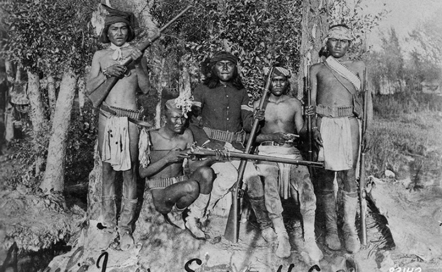 Apache Scouts at Fort Apache circa 1884. The man seated in the center is “Cut-Mouth,” the first sergeant of Company A.