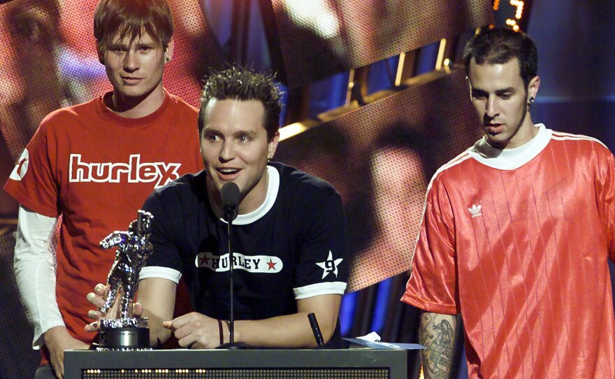 Blink 182 accepts the "Best Group Video" award for their song "All the Small Things" at the 2000 MTV Video Music Awards Thursday, Sept. 7, 2000, at Radio City Music Hall in New York. The group, from left, is Tom DeLonge, Mark Hoppus and Travis Barker.